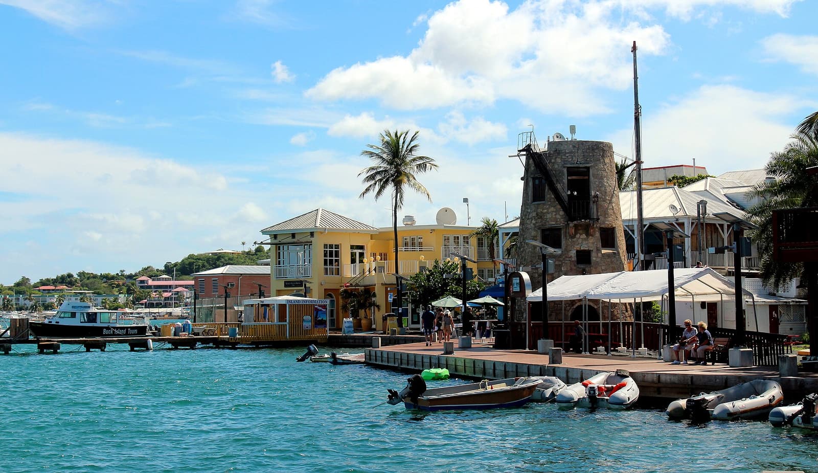 The Christiansted boardwalk on St. Croix, with waterfront restaurants and a stone tower