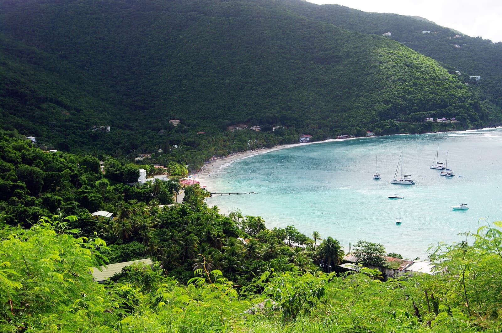 Cane Garden Bay on Tortola, with sailboats in the bay below green hills
